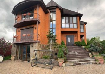 House on a hill overlooking the forest